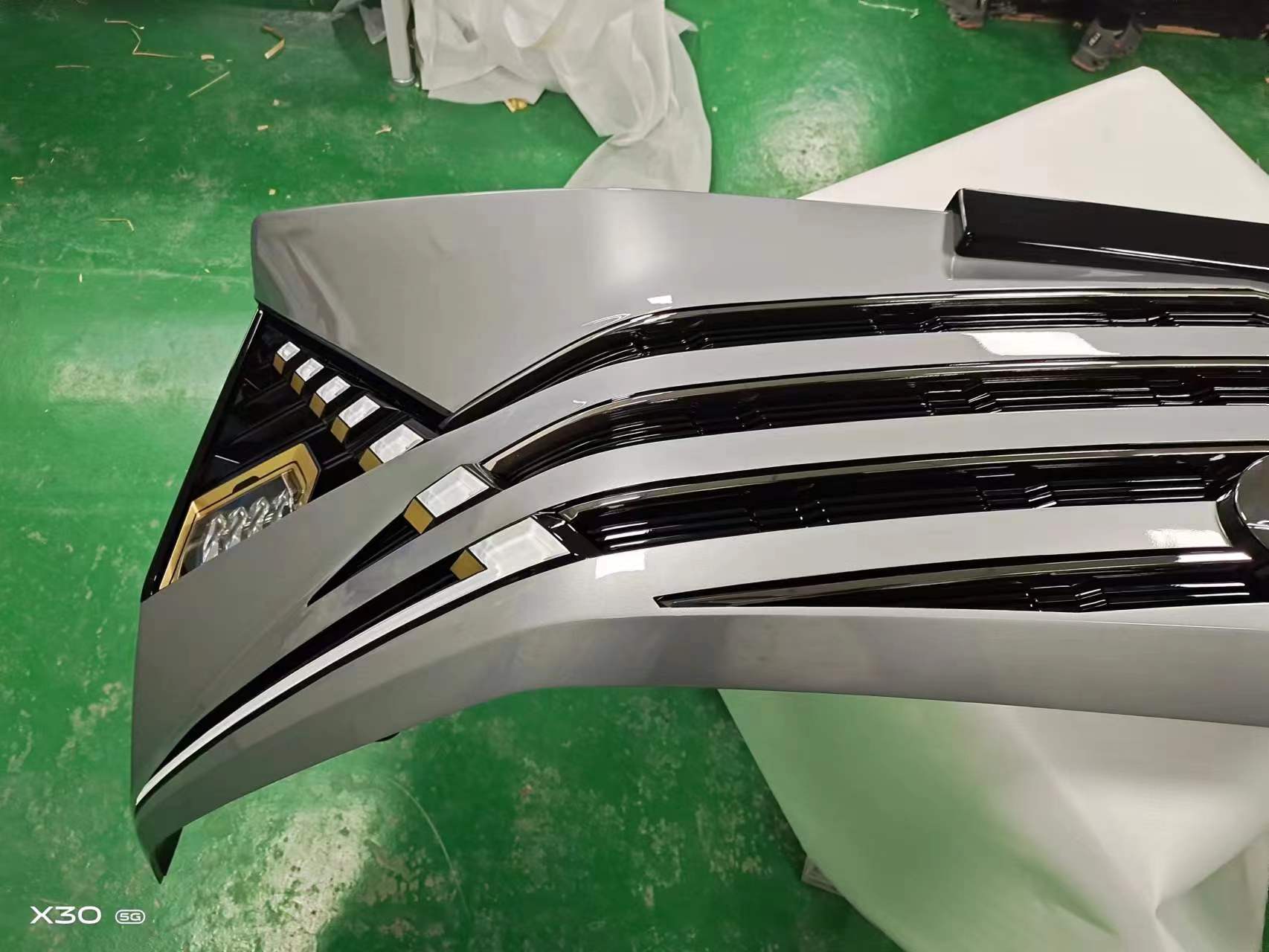 CNC machining a 1:1 scale precision aluminum alloy spoiler.